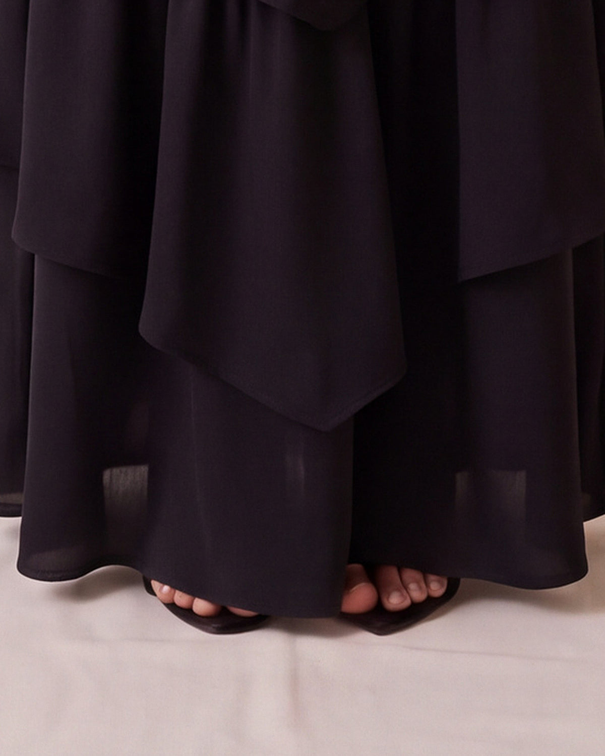 Rosalia Dress in Black Chiffon Satin, hem detail