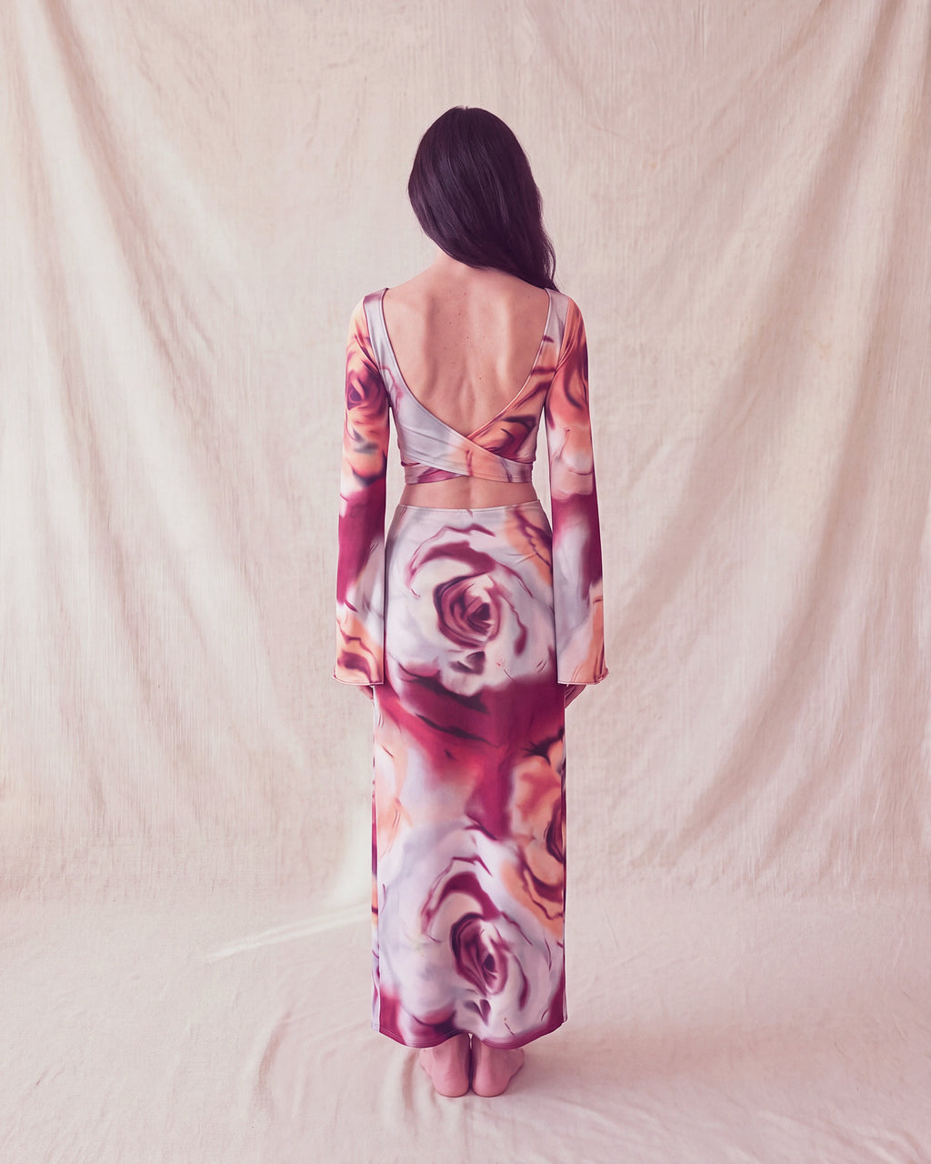 Bloom Top and Bloom Skirt in rose print, back view with the open back and crossed ties