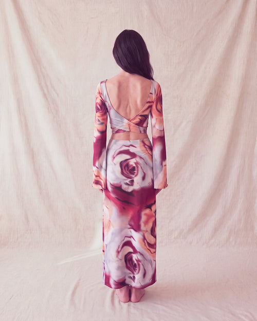 Bloom Top and Bloom Skirt in rose print, back view with the open back and crossed ties