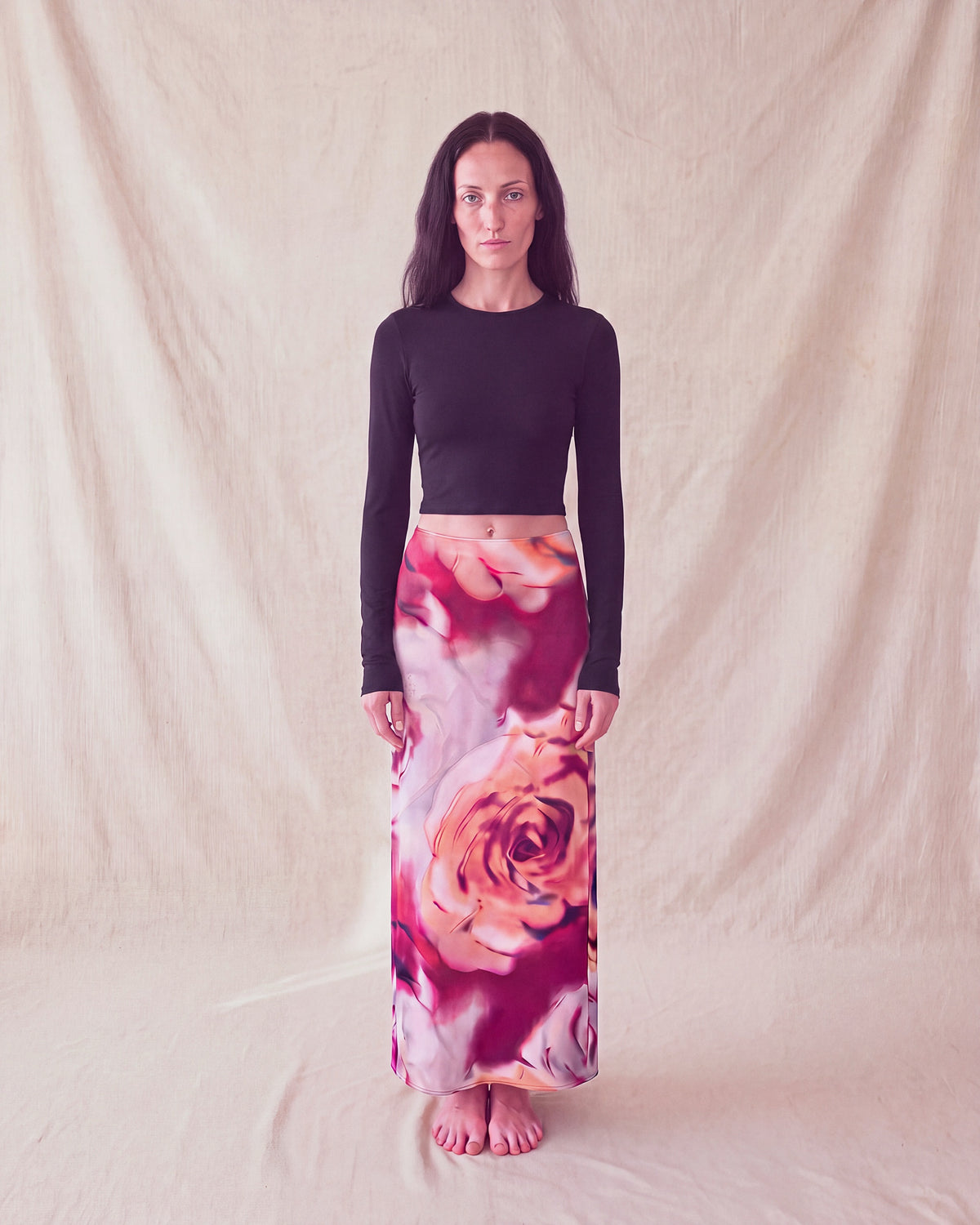 Bloom Skirt in rose print, a maxi slip skirt, worn with a black long sleeve top