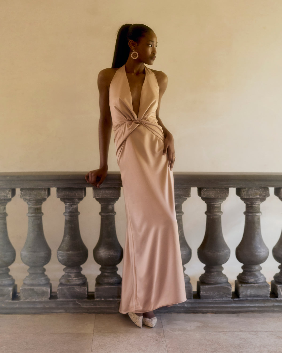 Idai Dress in soft pink satin with a twist front and halter neck