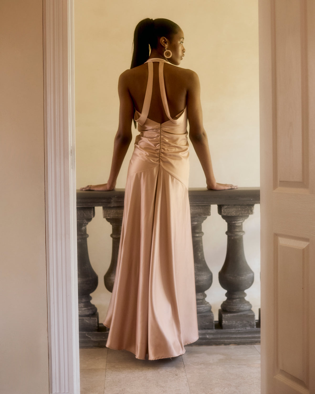Open strap back of the Idai Dress in soft pink satin