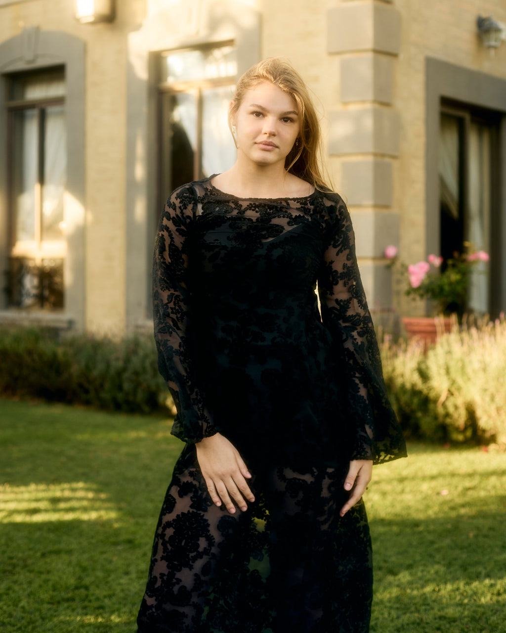 Reiko Dress in black in a garden