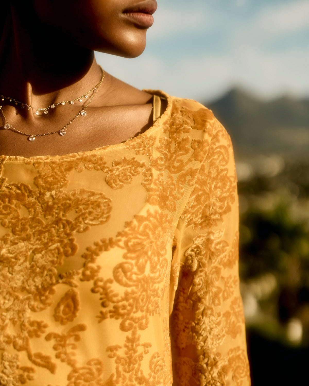 Neckline and pattern of the Reiko Dress in yellow, close up