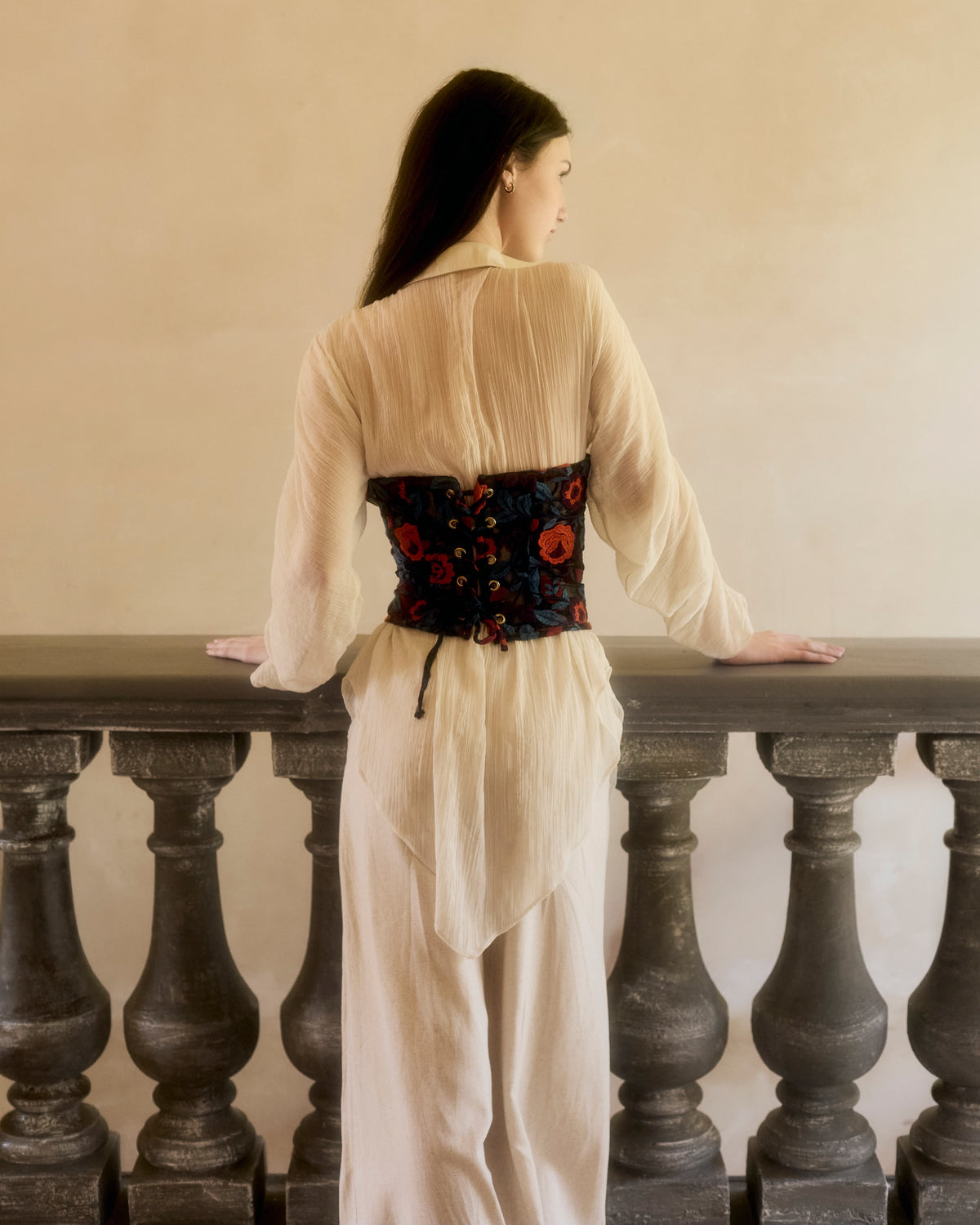 Laced back of the Rosalia Corset in floral lace