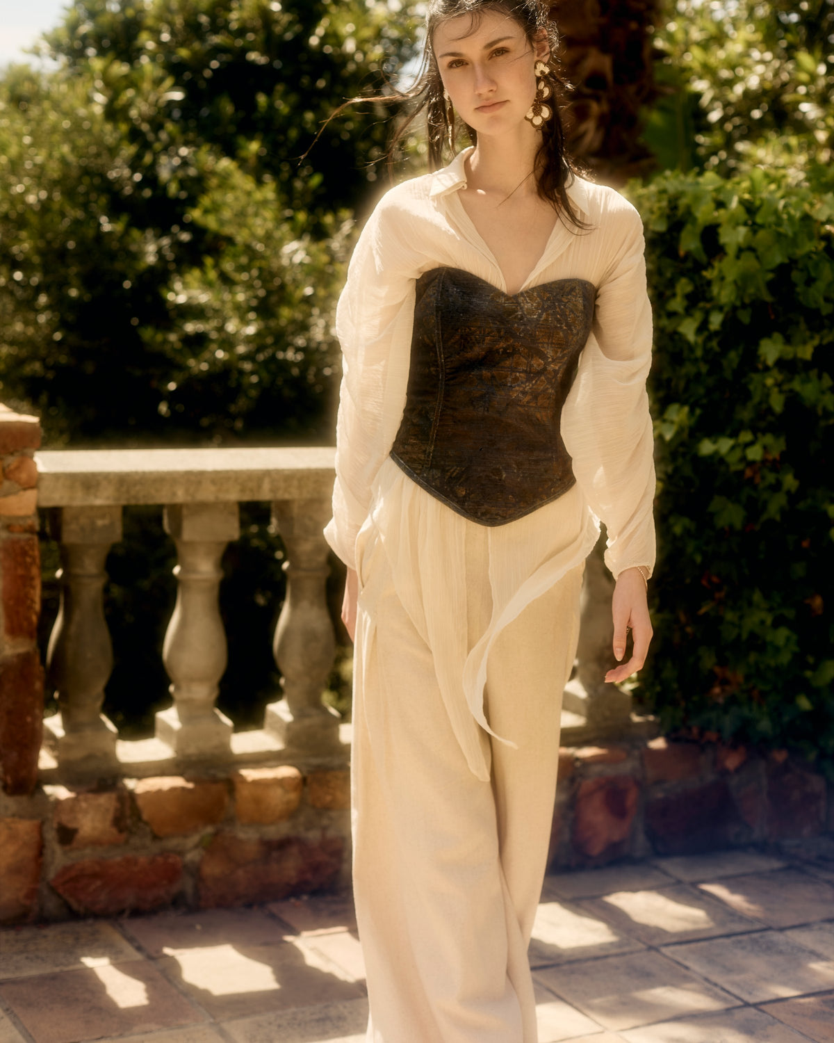Rosalia Corset in blue and green velvet over a cream shirt and trousers