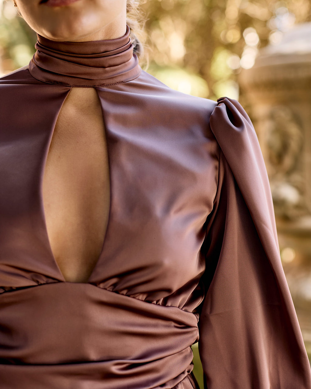 Keyhole neckline and puff sleeves of the Tariro Dress