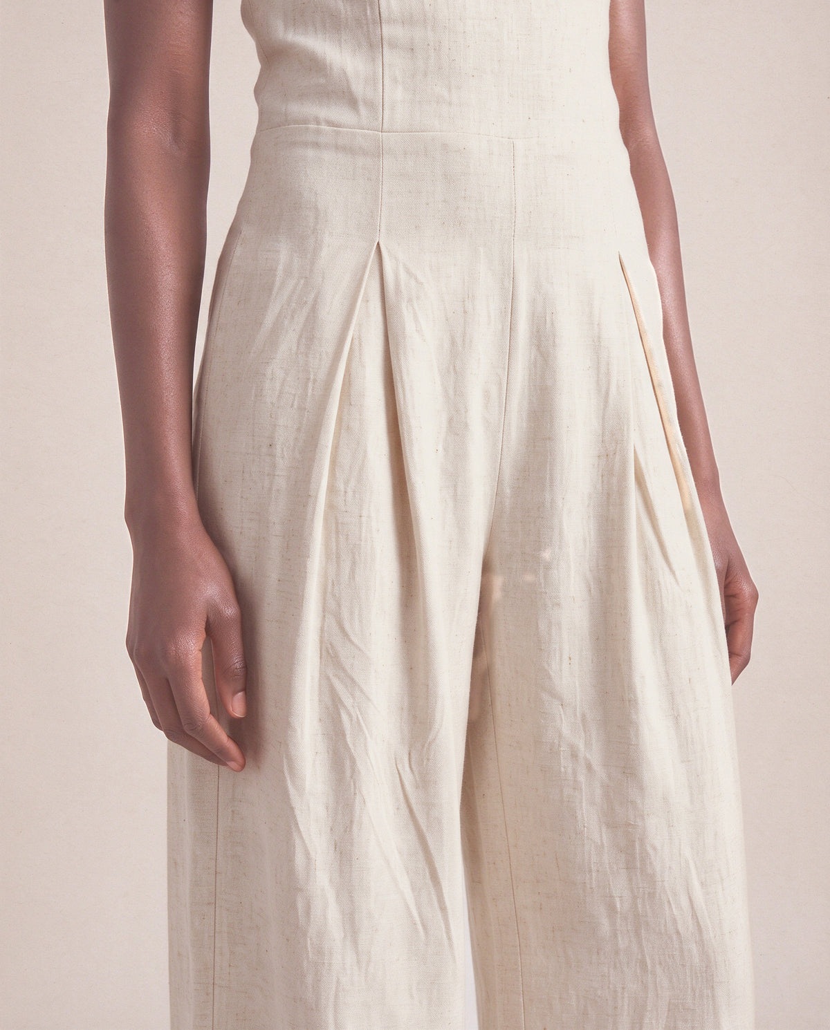 Camille Jumpsuit in Beige, front pleats
