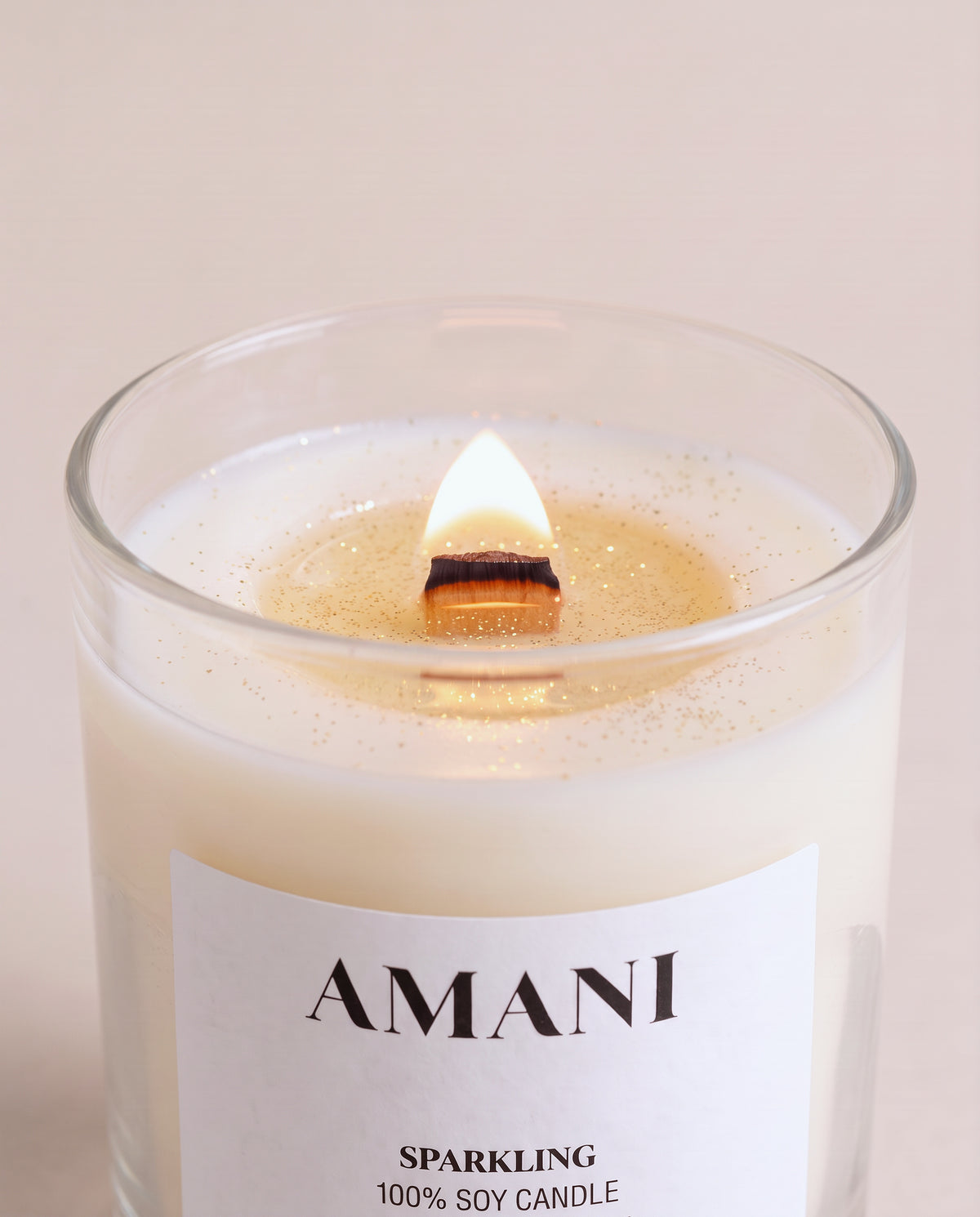 Sparkling Candle, lit, the wax sparkles